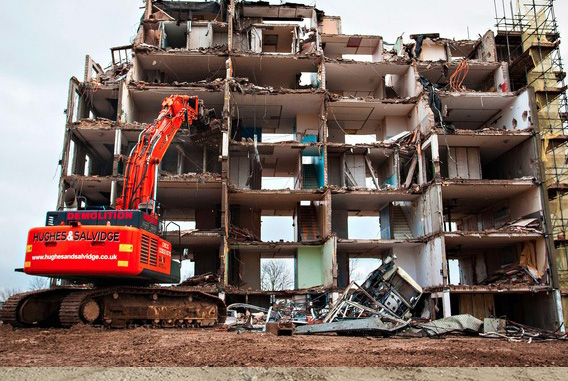 Vehicle destroying building