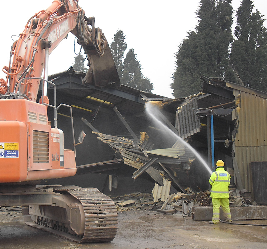 Asbestos is safely removed to prepare for a building demolition